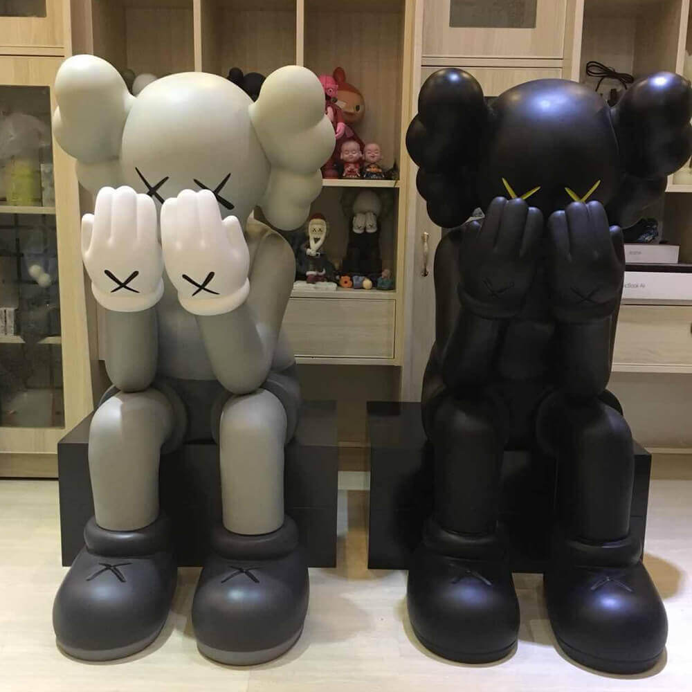 sitting kaws statue