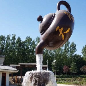 Floating teapot fountain sculpture