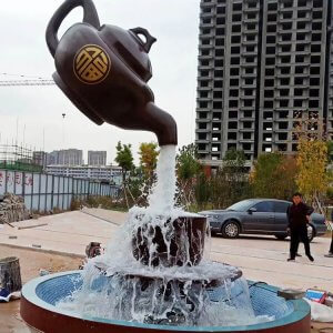Floating teapot fountain sculpture