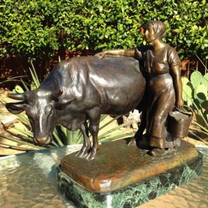 Life Size Bronze Cow And Milking Woman Sculpture For Sale