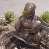 Bronze Teacher And Children Reading Sculpture For Sale - Image 3
