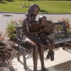 Bronze Teacher And Children Reading Sculpture For Sale - Image 2