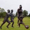 Bronze Child Playing Soccer Statue For Sale - Image 2
